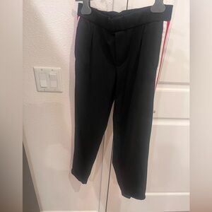 Black trousers with white and red stripes on side, straight fit